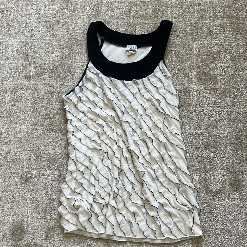 White frilly tank top with black accents.